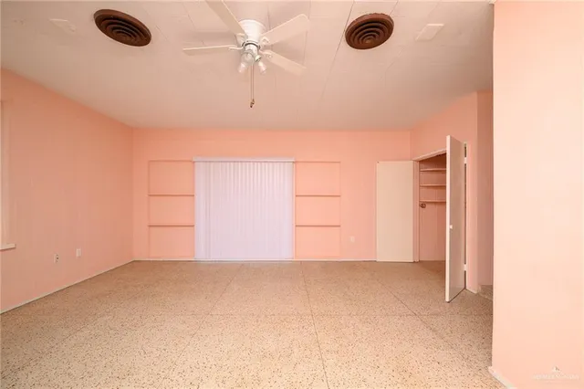 an empty room with windows