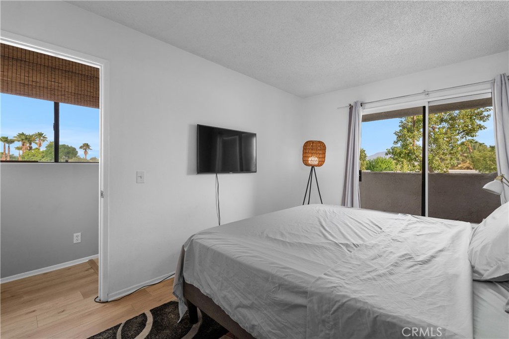 69646 Antonia Way Rancho Mirage, CA 92270 - Photo 38 of 50 a bedroom with a bed and a window