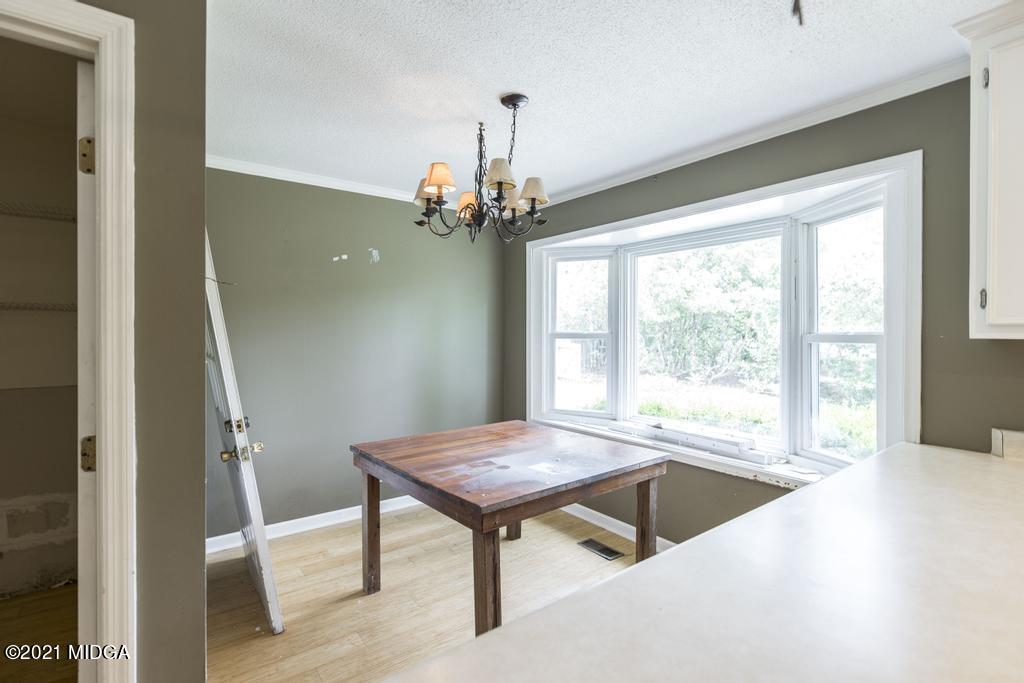 225 Beacon Hill Road Macon, GA 31210 - Photo 14 of 29 a view of a room with furniture wooden floor and a window