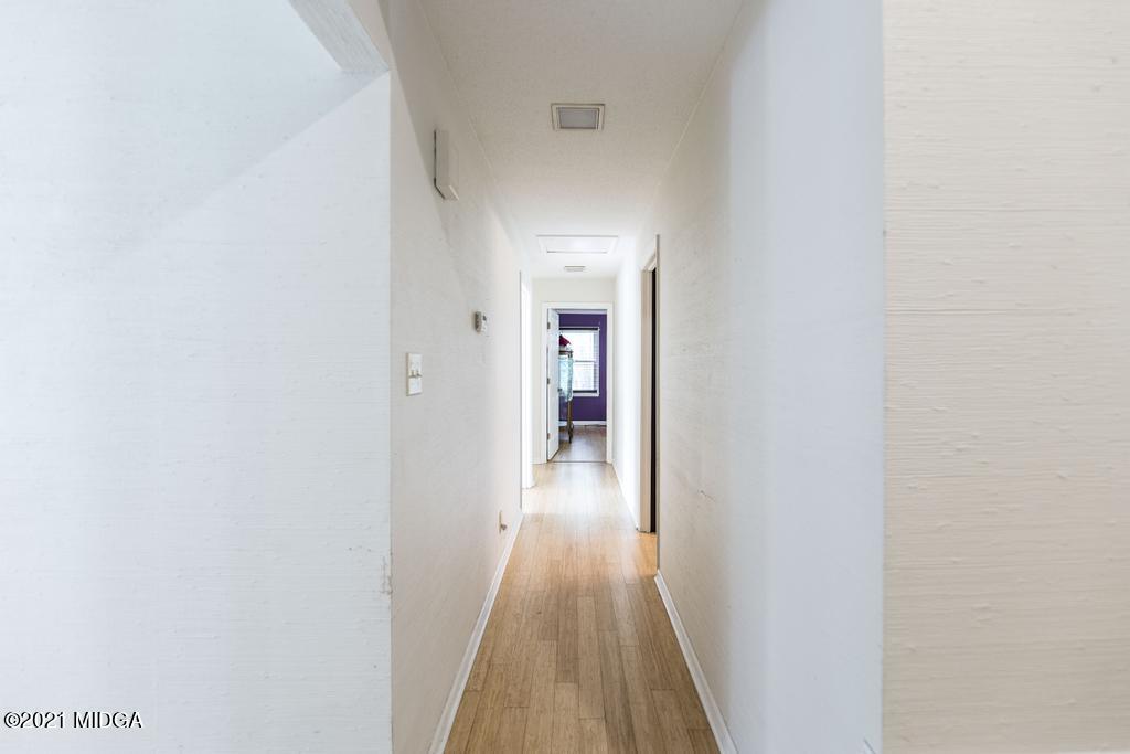 225 Beacon Hill Road Macon, GA 31210 - Photo 16 of 29 a view of a hallway with wooden floor