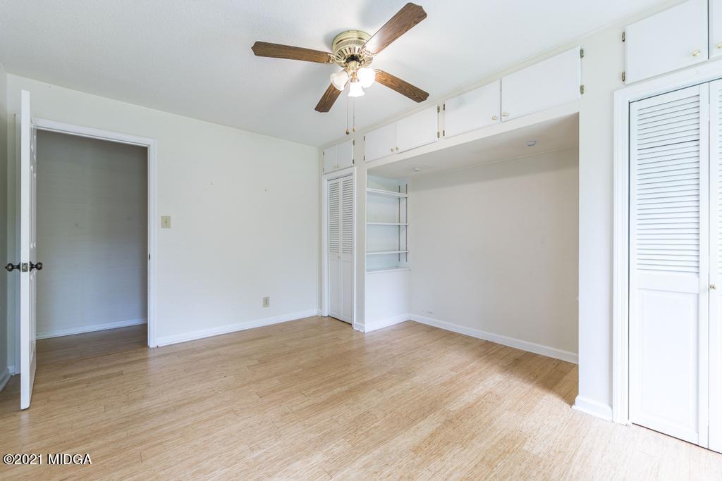 225 Beacon Hill Road Macon, GA 31210 - Photo 19 of 29 a view of an empty room with a ceiling fan