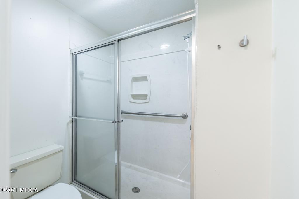 225 Beacon Hill Road Macon, GA 31210 - Photo 26 of 29 a bathroom with a glass shower door