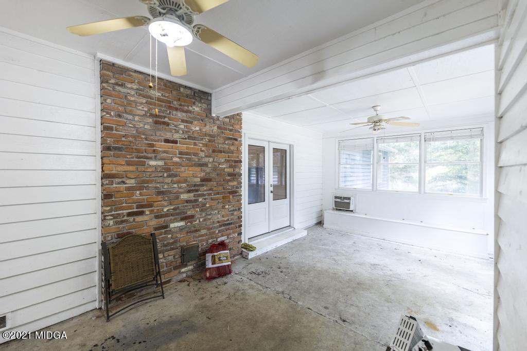 225 Beacon Hill Road Macon, GA 31210 - Photo 27 of 29 a view of an empty room and chandelier fan