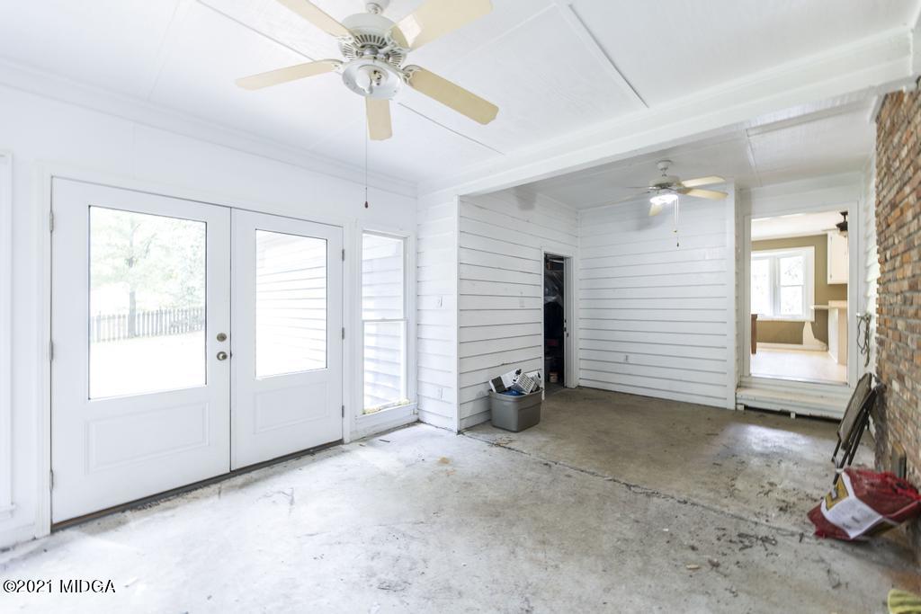 225 Beacon Hill Road Macon, GA 31210 - Photo 28 of 29 a view of a livingroom with a staircase and a ceiling fan