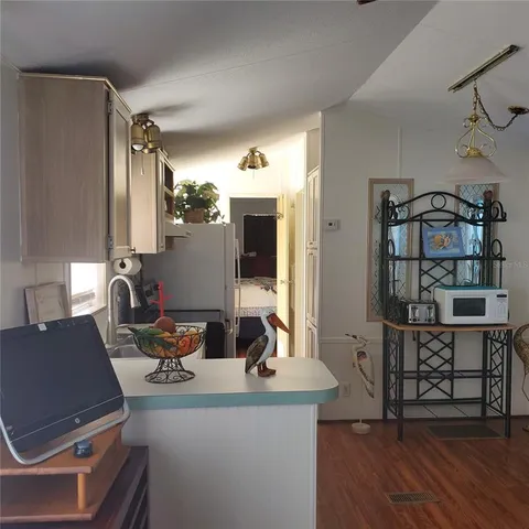 a view of a room with furniture window and wooden floor