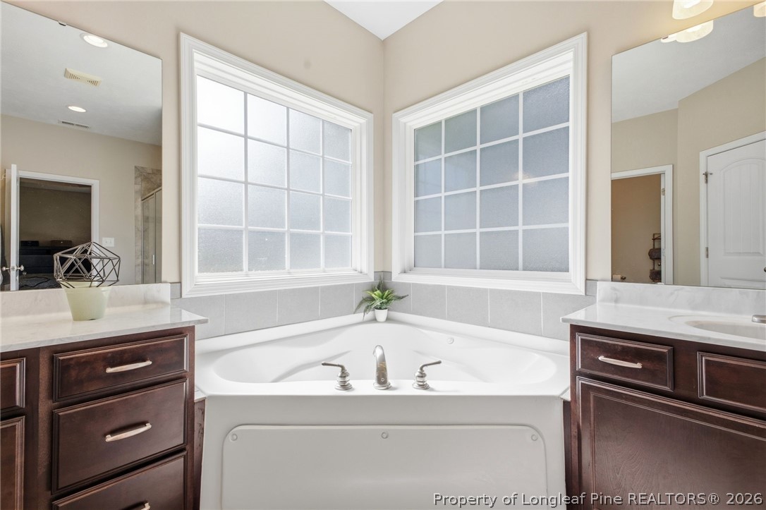 2589 June Johnson Road Raeford, NC 28376 - Photo 19 of 49 a bathroom with a sink and a bathtub