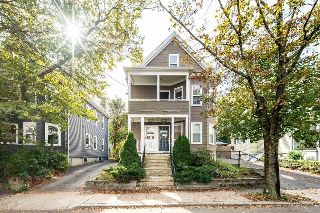 front view of a house with a yard
