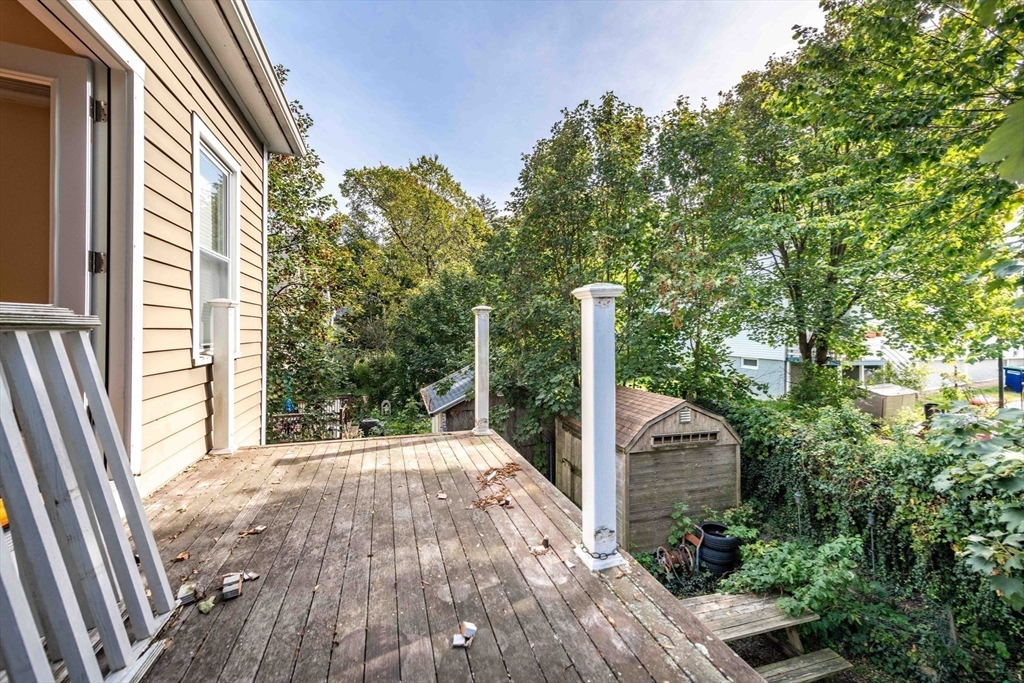 148 Albion Street, Unit 2 Somerville, MA 02144 - Photo 12 of 21 a front view of a house with a yard and balcony