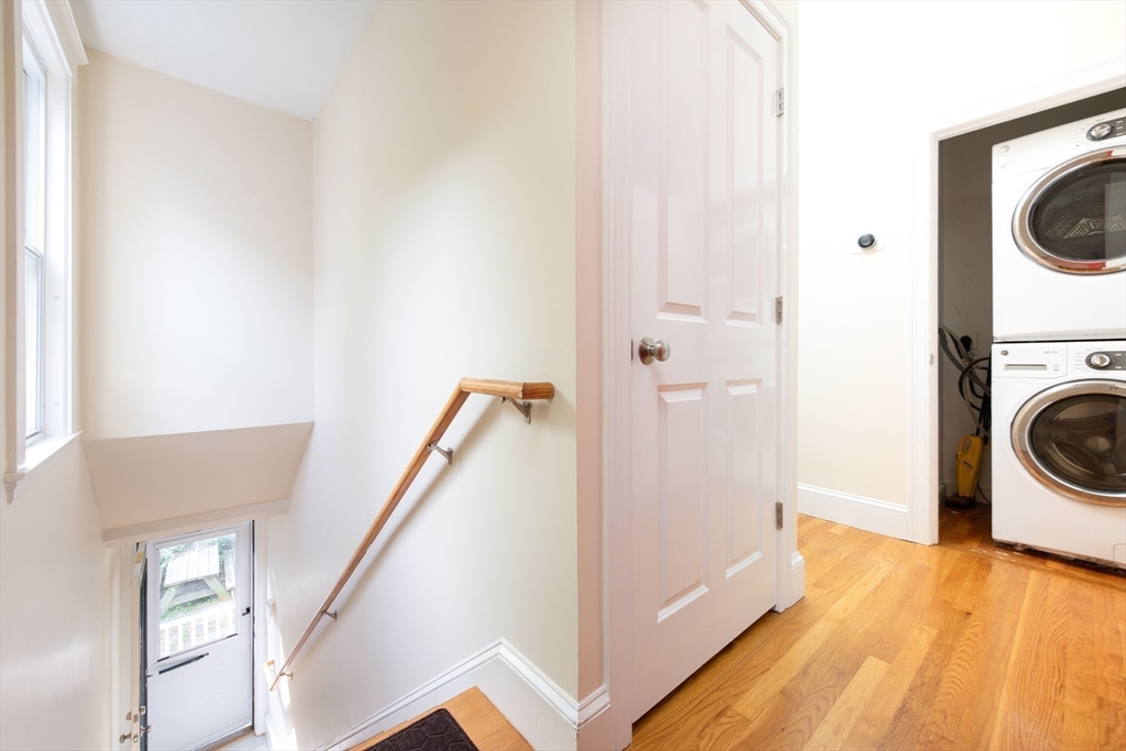 148 Albion Street, Unit 2 Somerville, MA 02144 - Photo 13 of 21 a view of a hallway with washer and dryer