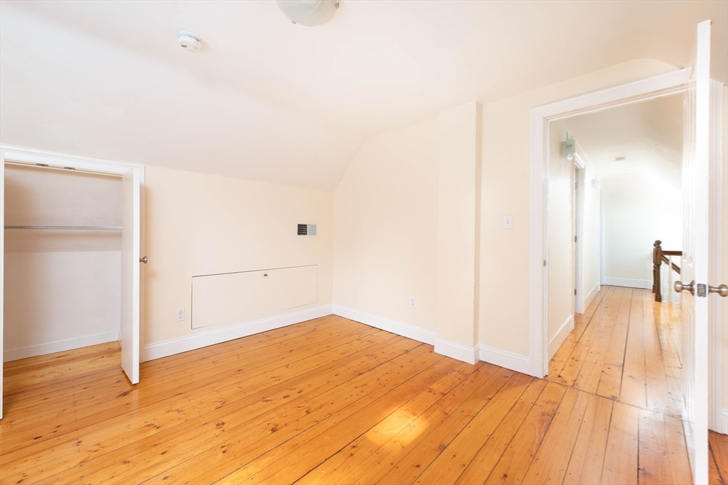 148 Albion Street, Unit 2 Somerville, MA 02144 - Photo 16 of 21 a view of a room with wooden floor