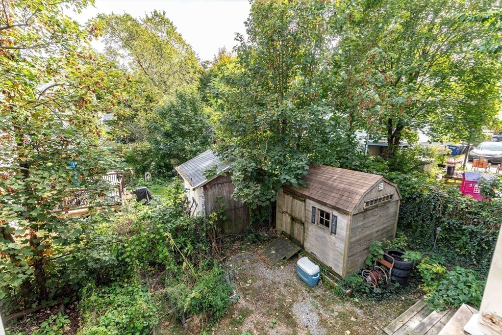 148 Albion Street, Unit 2 Somerville, MA 02144 - Photo 20 of 21 an aerial view of a house with a yard