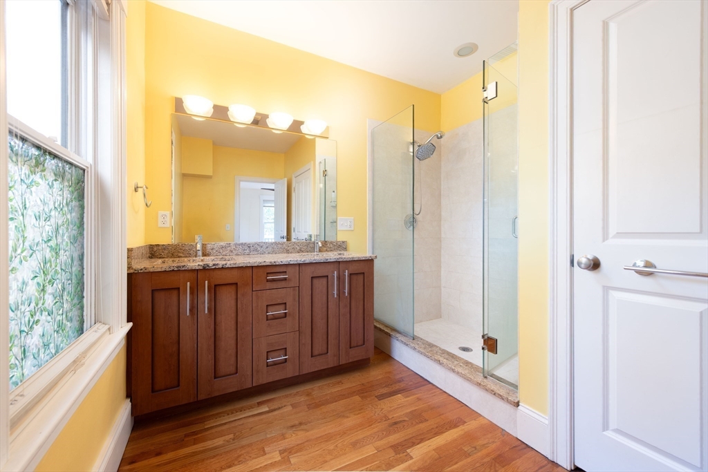 148 Albion Street, Unit 2 Somerville, MA 02144 - Photo 10 of 21 a bathroom with a double vanity sink and a mirror