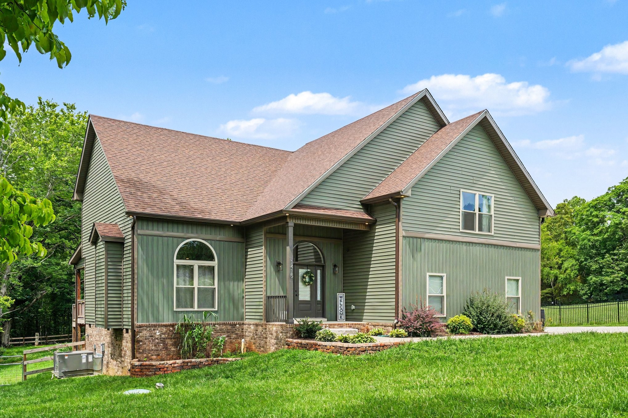 front view of a house with a yard