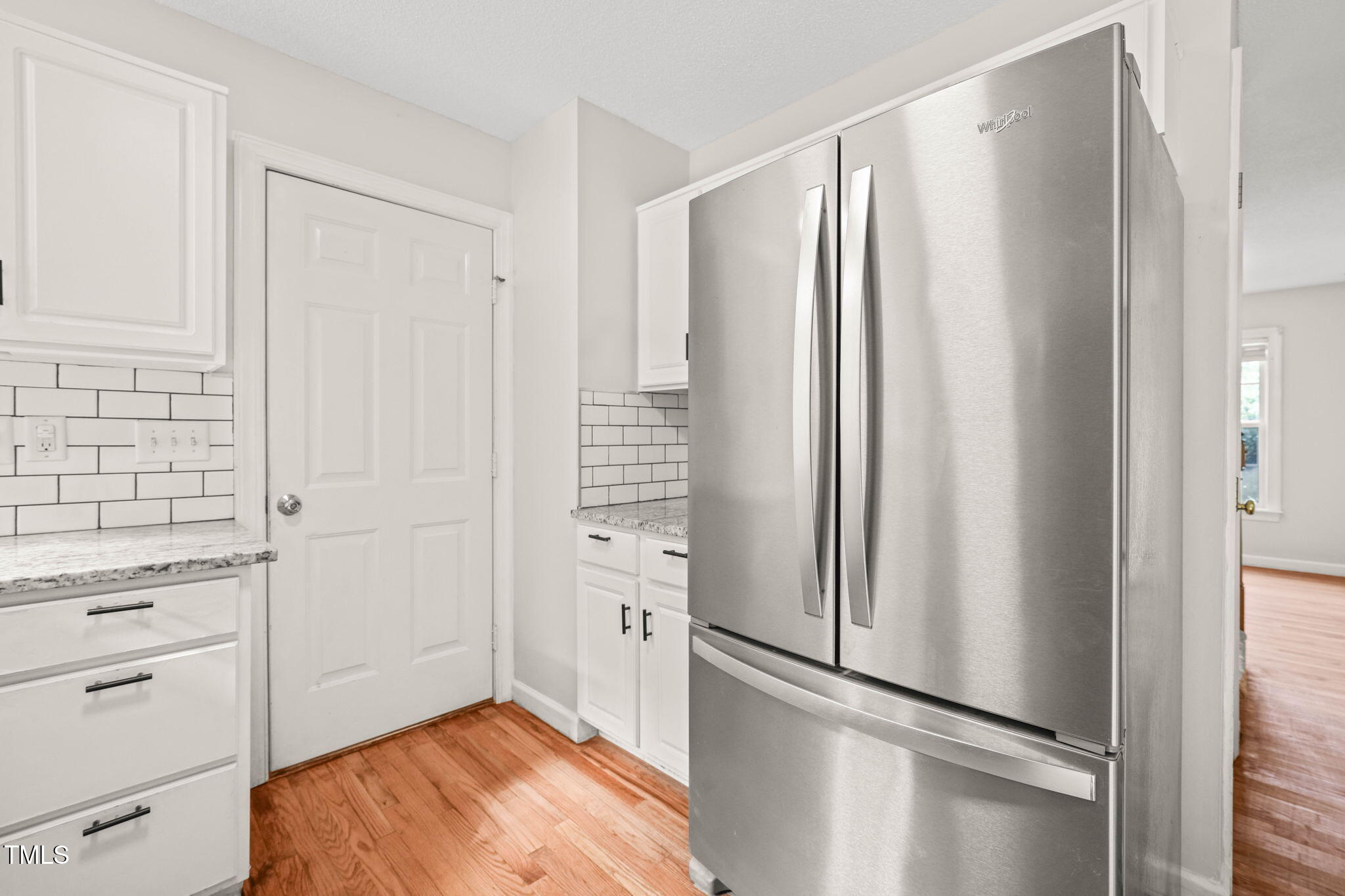 900 Borage Drive Wake Forest, NC 27587 - Photo 12 of 43 a view of kitchen with wooden floor and window