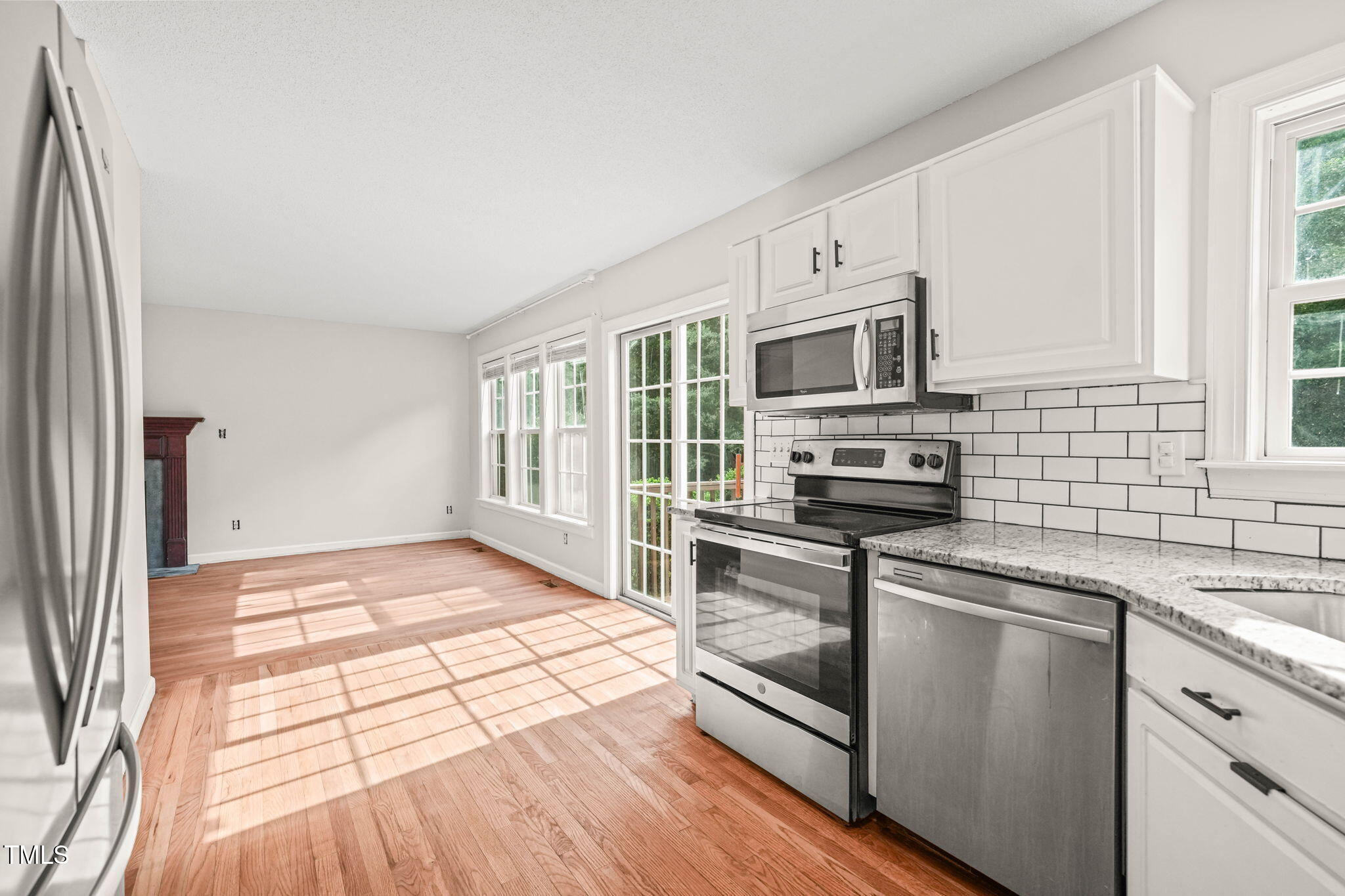 900 Borage Drive Wake Forest, NC 27587 - Photo 15 of 43 a kitchen with granite countertop a stove and a sink