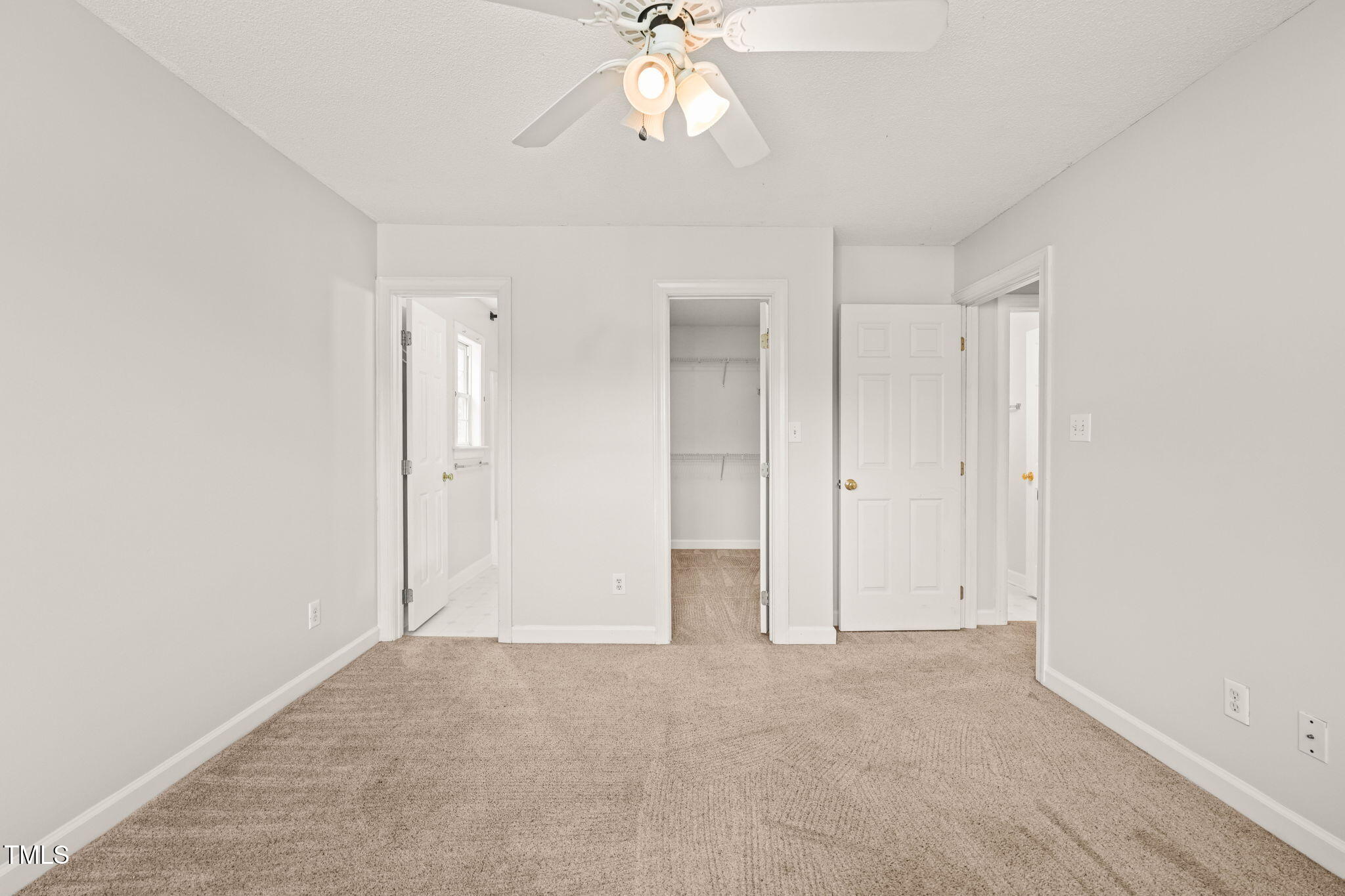 900 Borage Drive Wake Forest, NC 27587 - Photo 24 of 43 an empty room with chandelier fan and closet area
