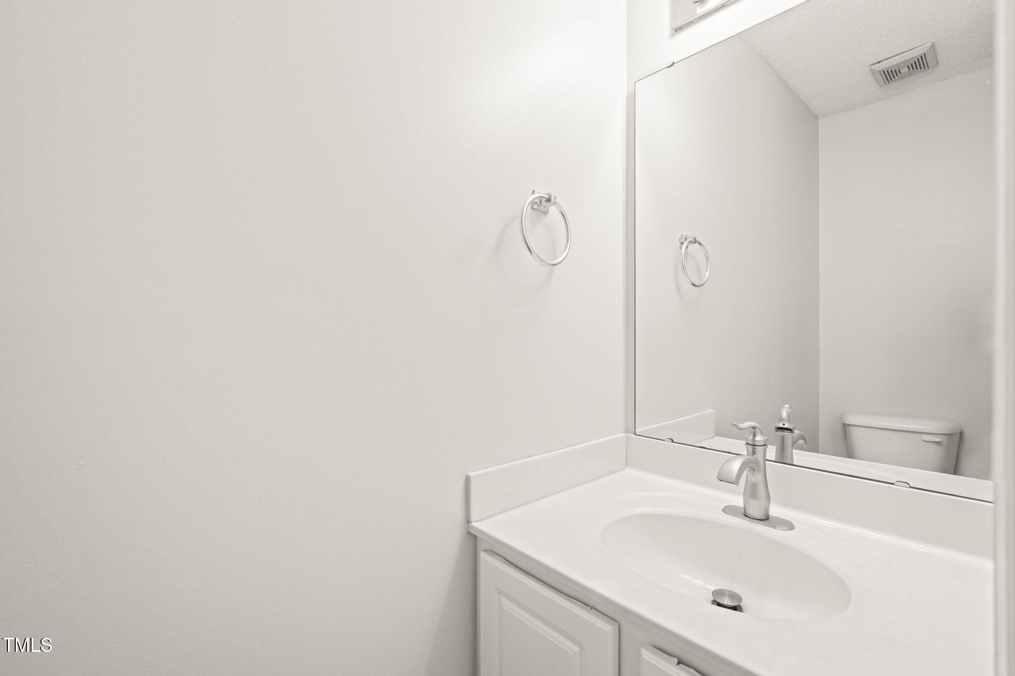 900 Borage Drive Wake Forest, NC 27587 - Photo 26 of 43 a bathroom with a sink and a mirror
