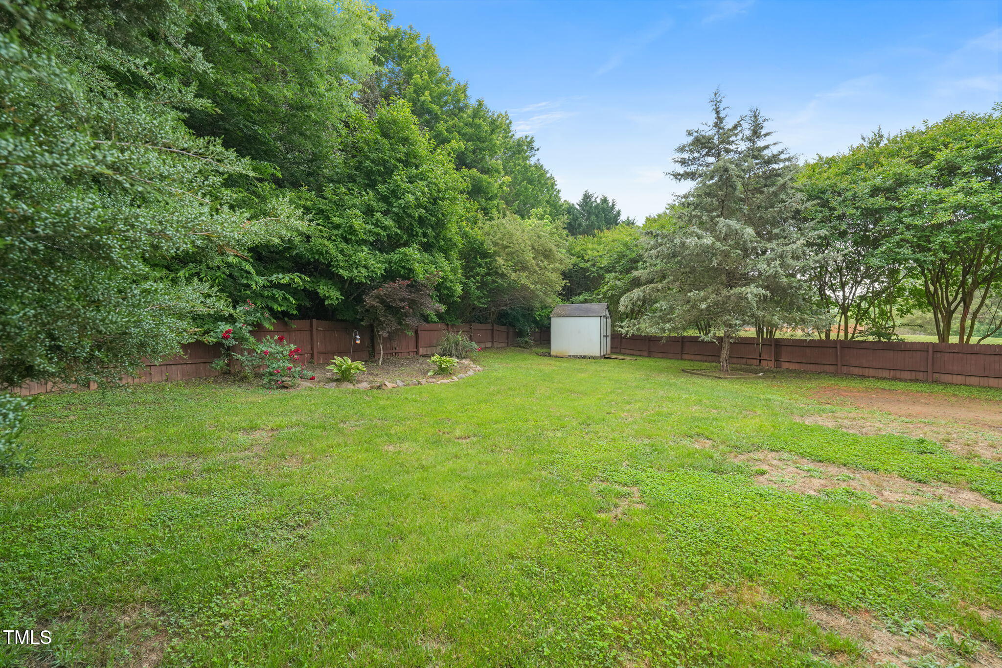 900 Borage Drive Wake Forest, NC 27587 - Photo 41 of 43 a view of a backyard with a garden