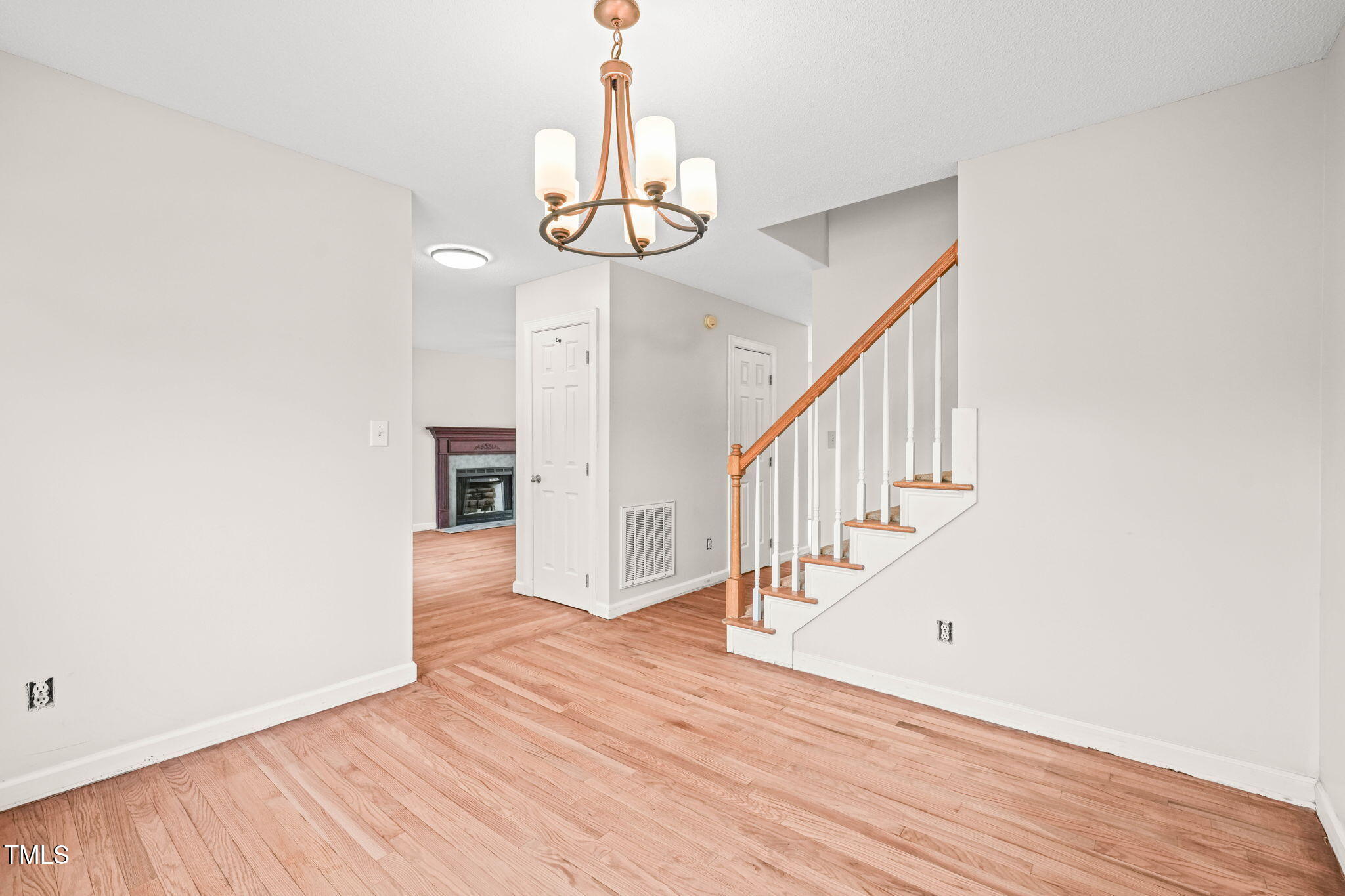 900 Borage Drive Wake Forest, NC 27587 - Photo 5 of 43 a view of entryway and hall with wooden floor