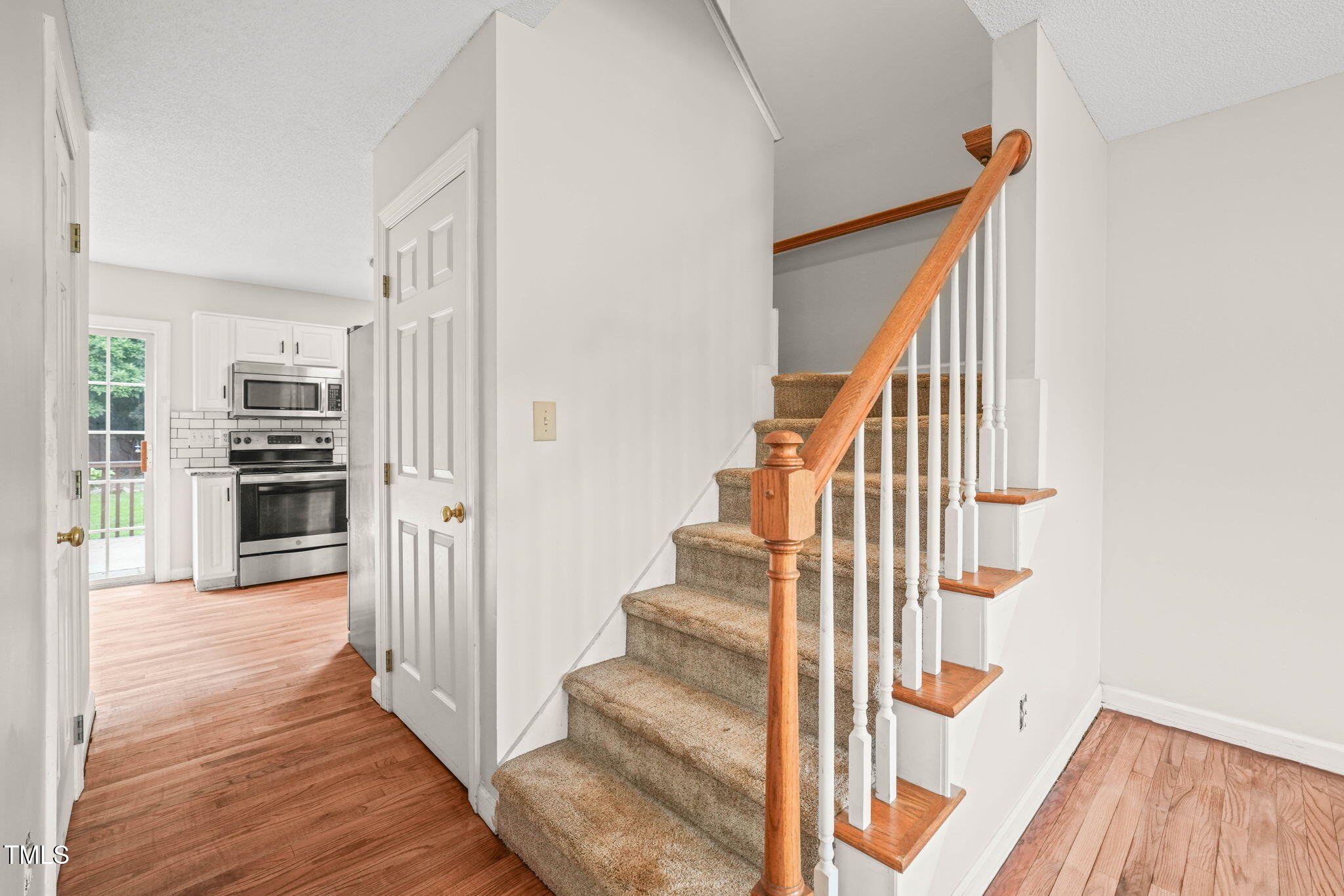 900 Borage Drive Wake Forest, NC 27587 - Photo 6 of 43 a view of a hallway with wooden floor and entryway