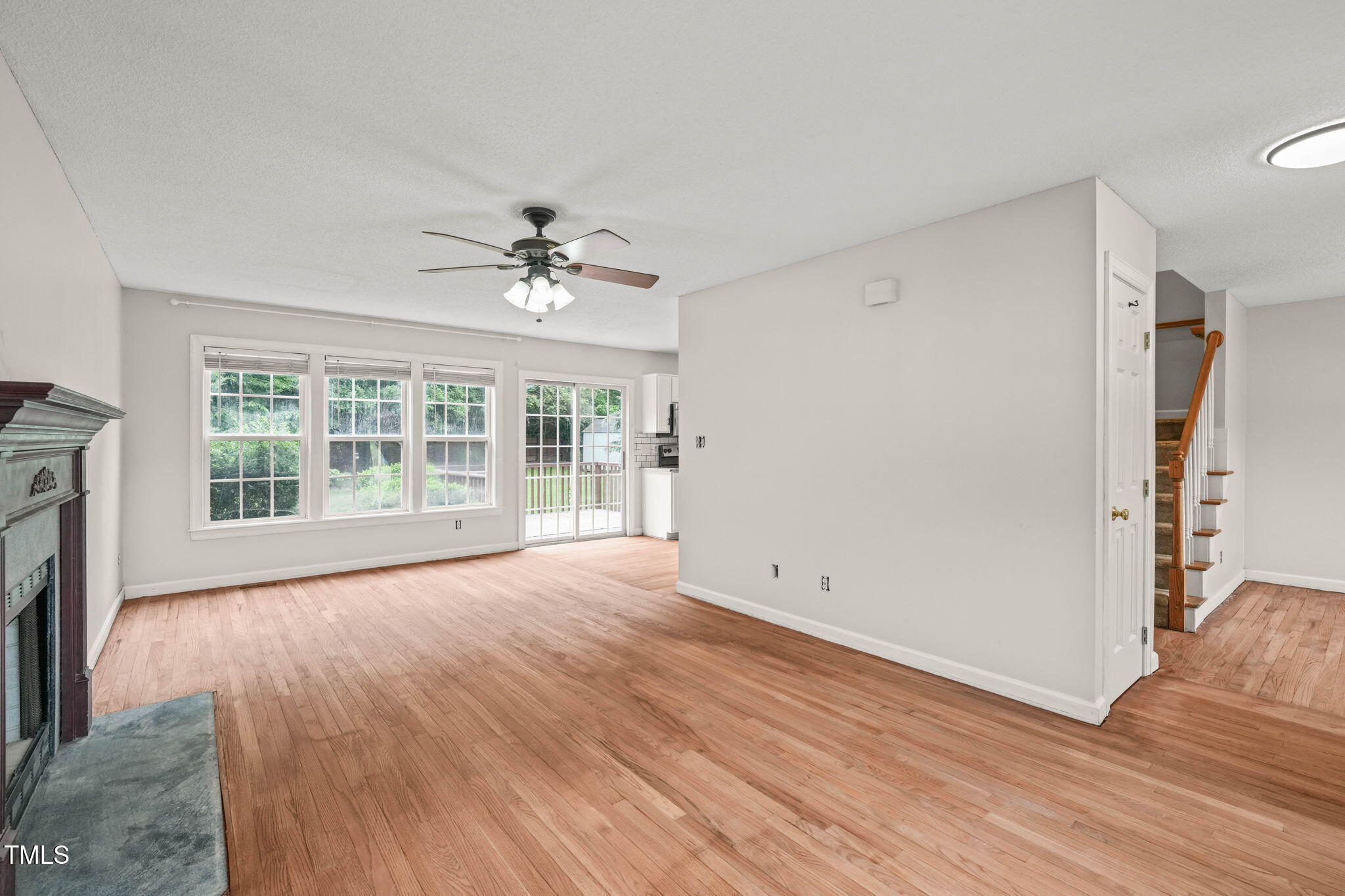 900 Borage Drive Wake Forest, NC 27587 - Photo 9 of 43 a view of an empty room with a window and wooden floor