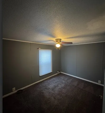 an empty room with a empty space and windows