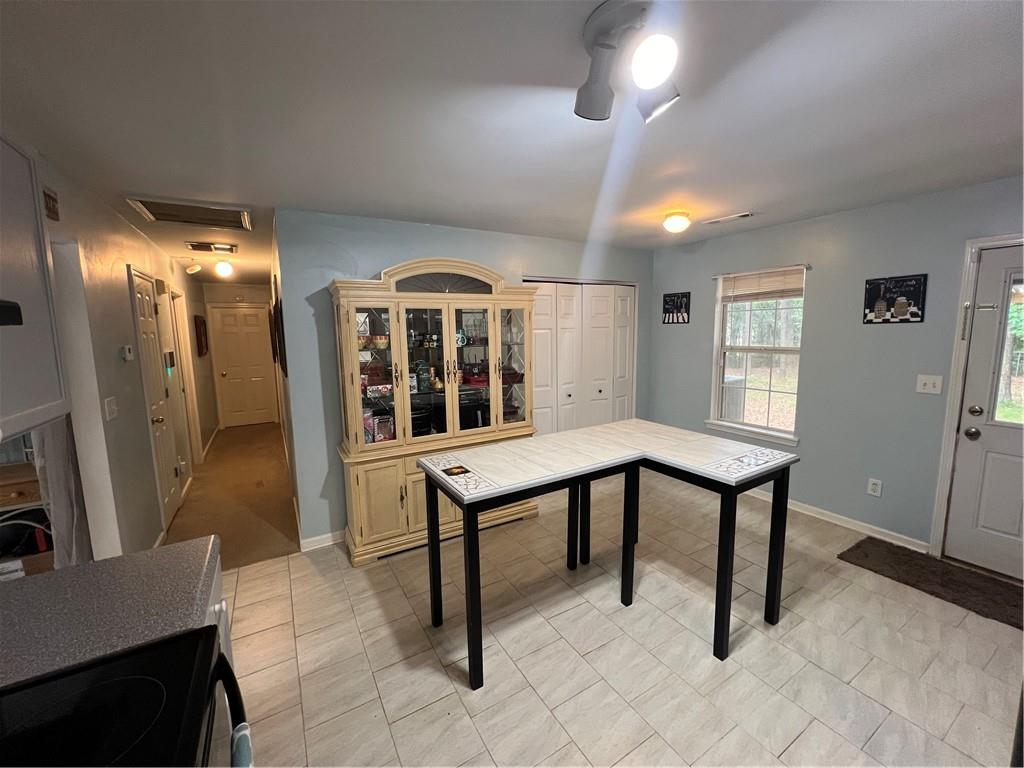 166 Barnetts Bridge Road Jackson, GA 30233 - Photo 11 of 29 a view of a livingroom with furniture and windows