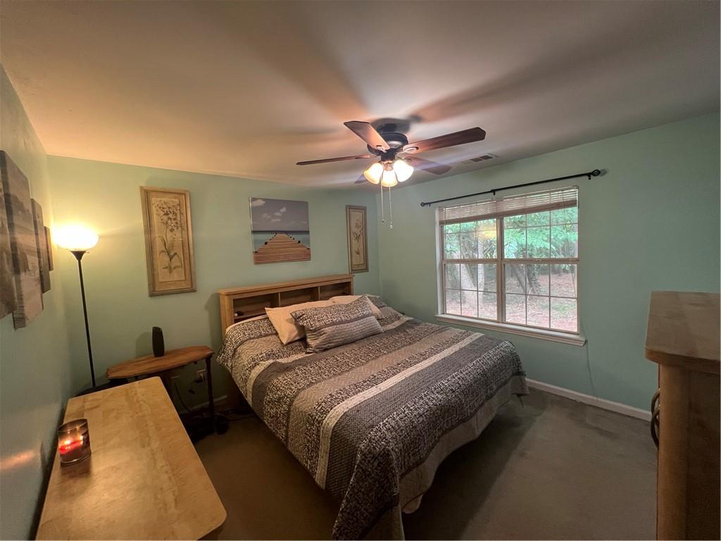 166 Barnetts Bridge Road Jackson, GA 30233 - Photo 12 of 29 a bedroom with a bed and a window