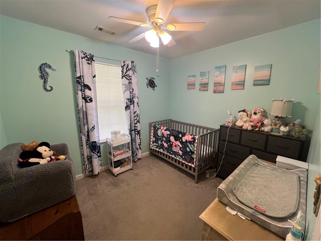 166 Barnetts Bridge Road Jackson, GA 30233 - Photo 17 of 29 a bedroom with bed and a chandelier