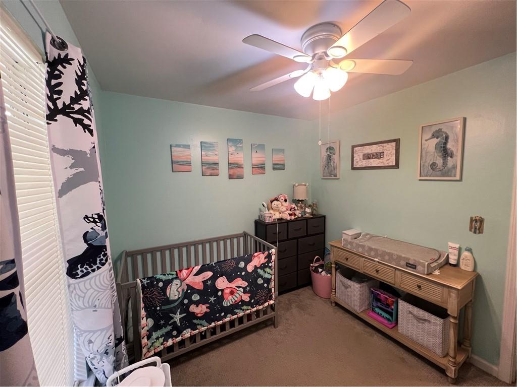 166 Barnetts Bridge Road Jackson, GA 30233 - Photo 18 of 29 a bed room with furniture and a baby crib