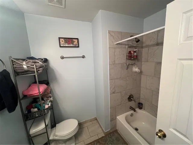 a bathroom with a toilet and a sink