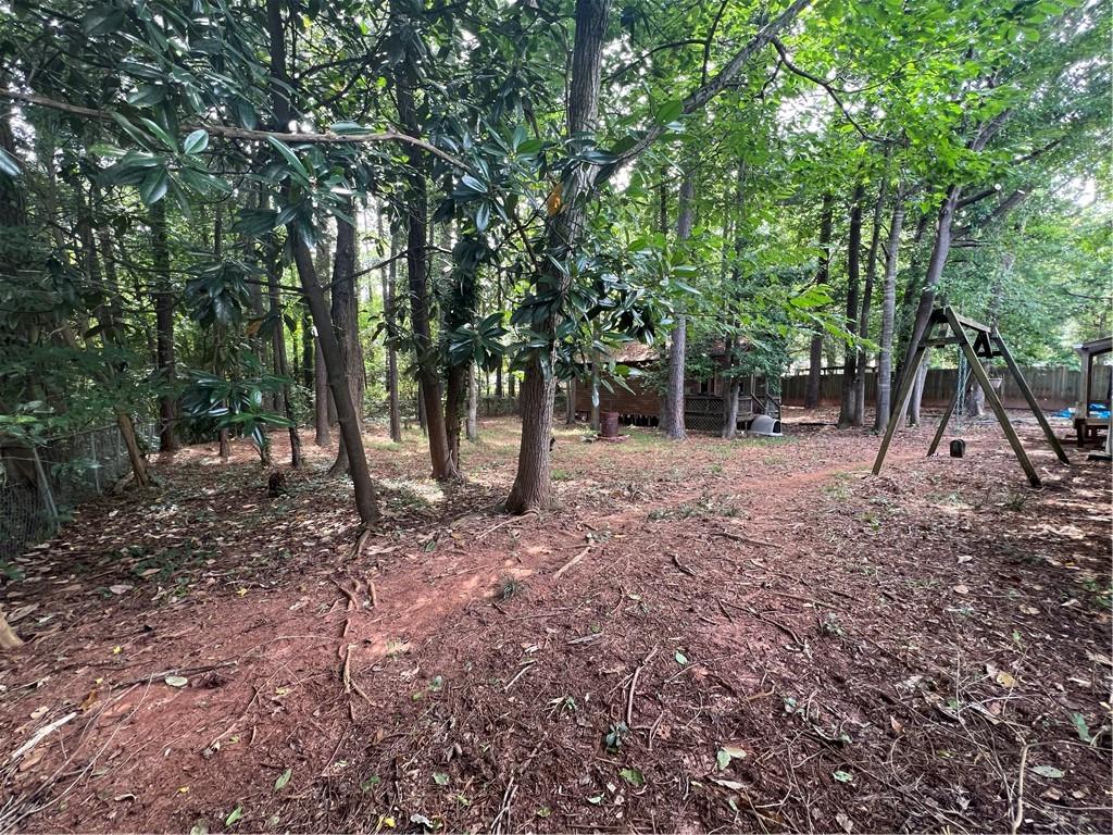166 Barnetts Bridge Road Jackson, GA 30233 - Photo 26 of 29 a view of a forest filled with trees