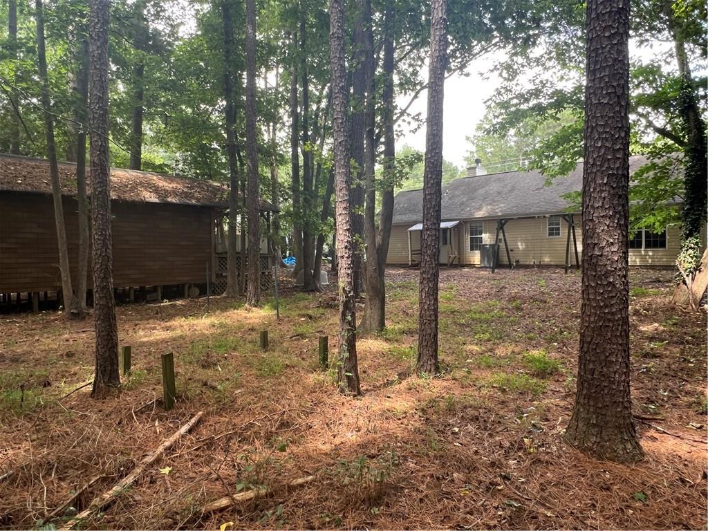 166 Barnetts Bridge Road Jackson, GA 30233 - Photo 28 of 29 a backyard of a house with lots of green space