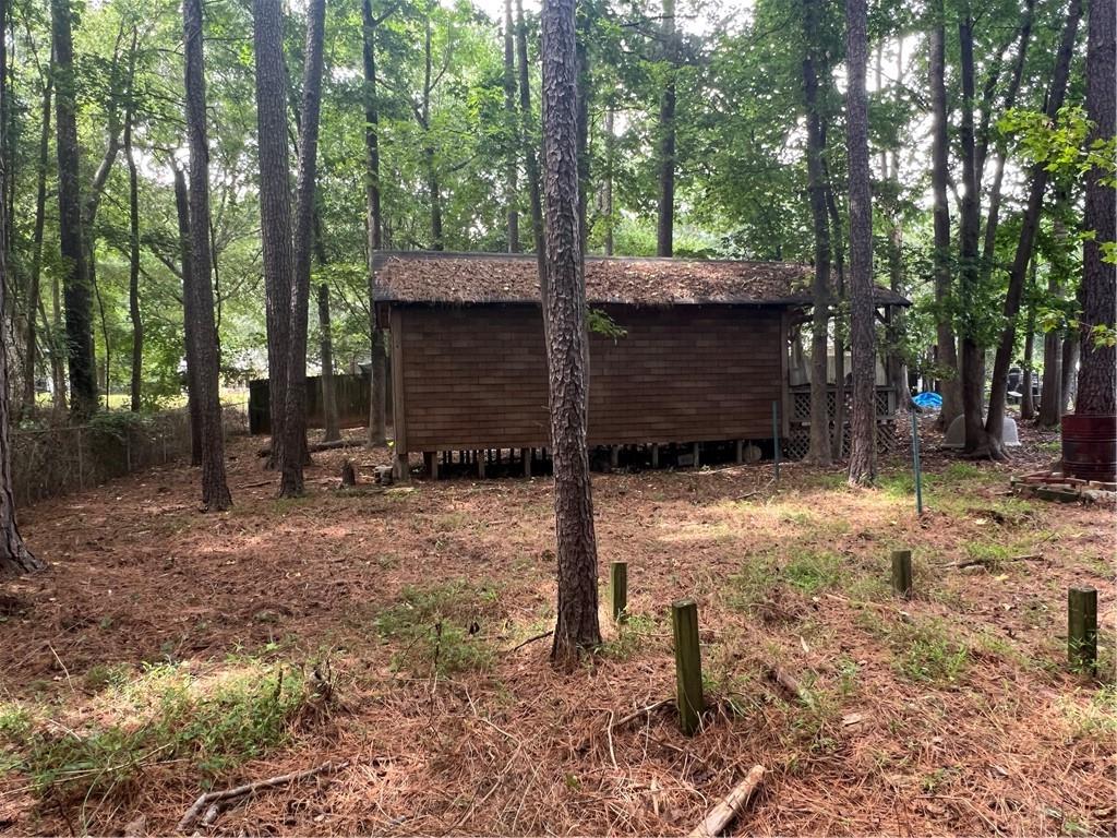 166 Barnetts Bridge Road Jackson, GA 30233 - Photo 29 of 29 a backyard of a house with lots of green space