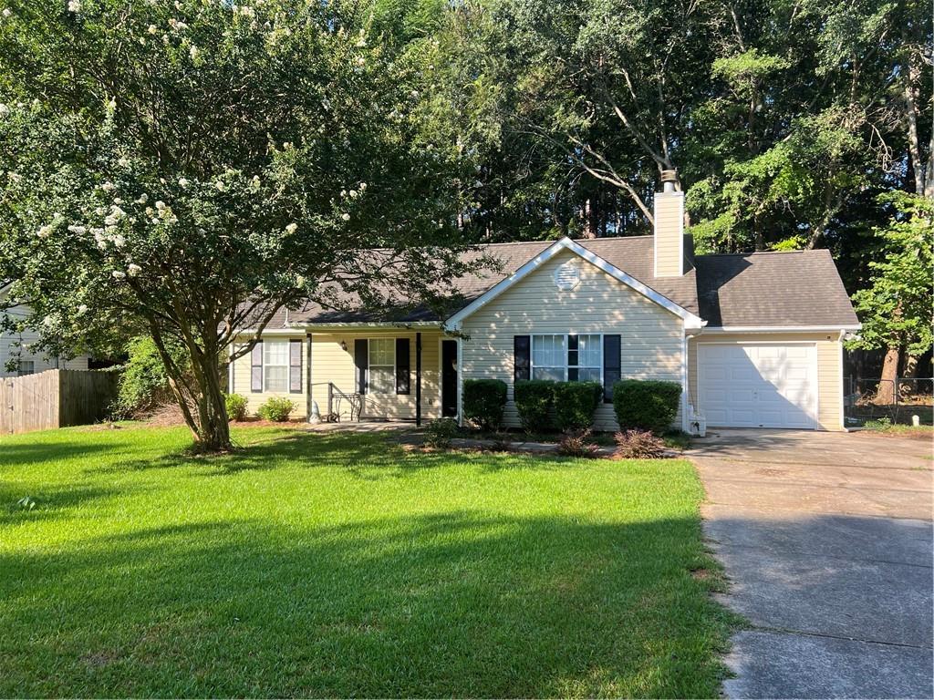 166 Barnetts Bridge Road Jackson, GA 30233 - Photo 3 of 29 a front view of a house with a yard and trees