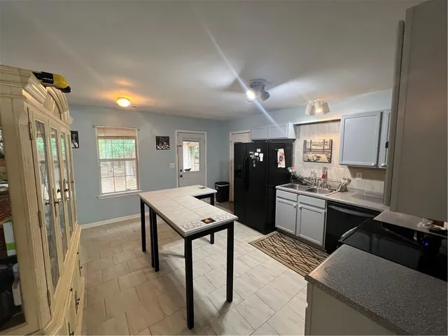 a kitchen with granite countertop lots of counter top space