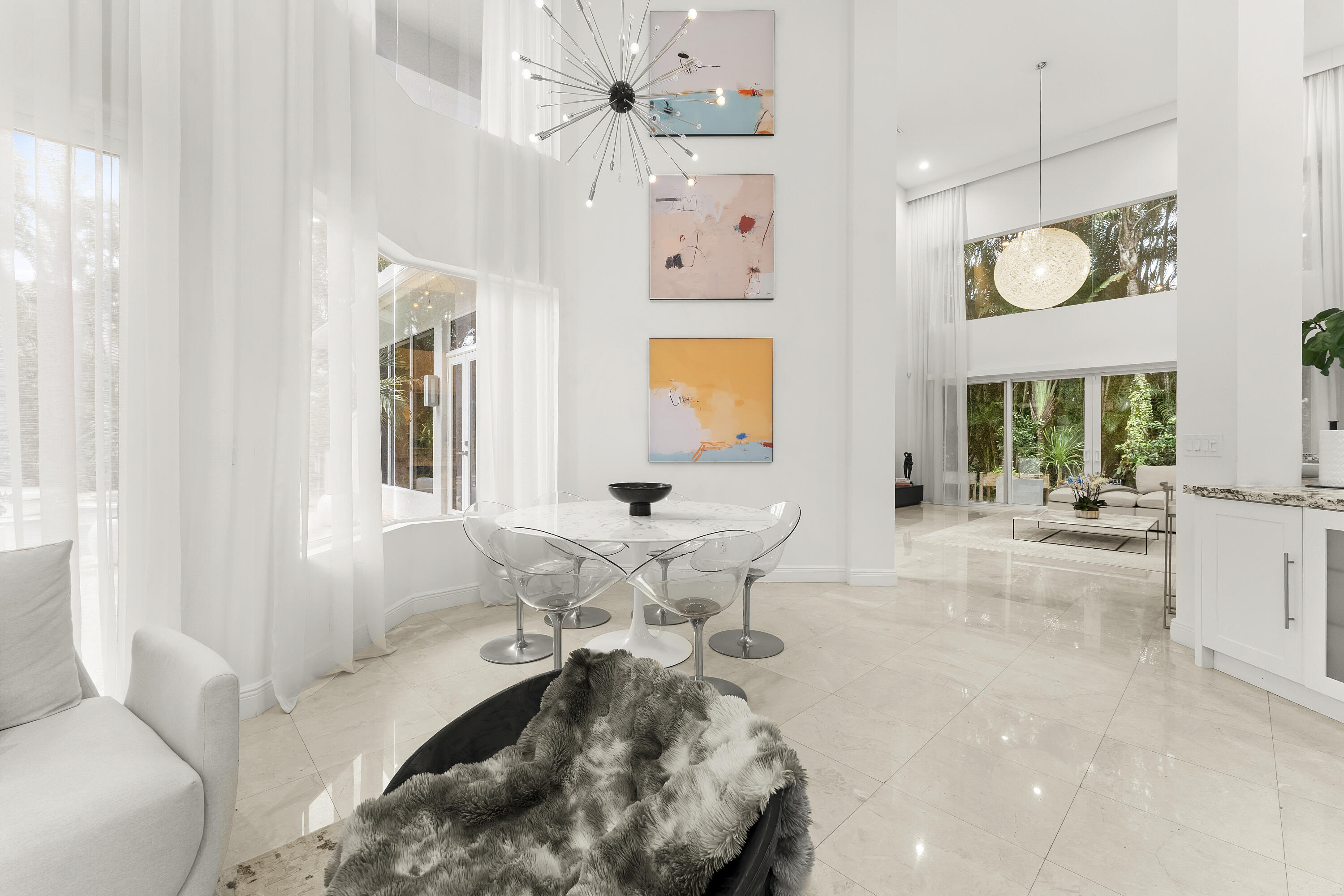 3156 Northwest 61st Street Boca Raton, FL 33496 - Photo 22 of 46 a living room with furniture and a large window