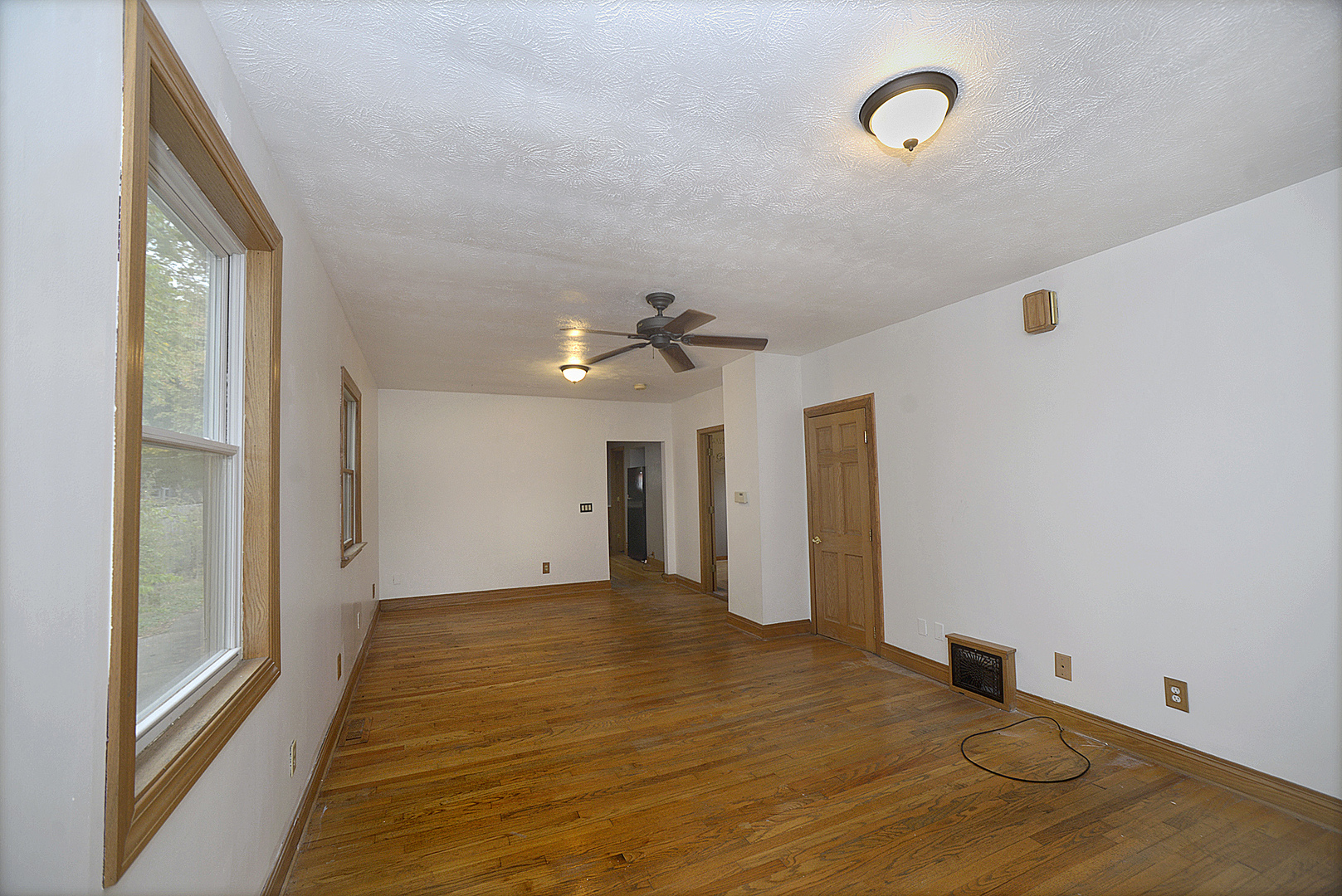 614 2nd Avenue Ottawa, IL 61350 - Photo 5 of 11 a view of a room with wooden floor and ceiling fan