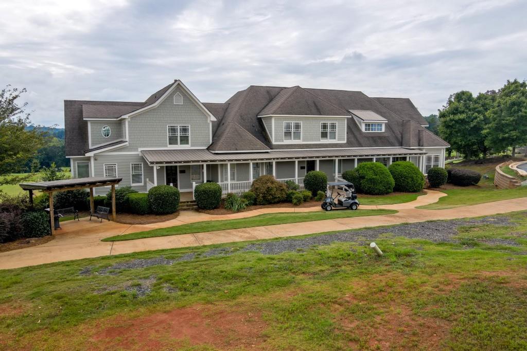 176 Greenview Court Homer, GA 30547 - Photo 17 of 19 a front view of a house with a yard table and chairs