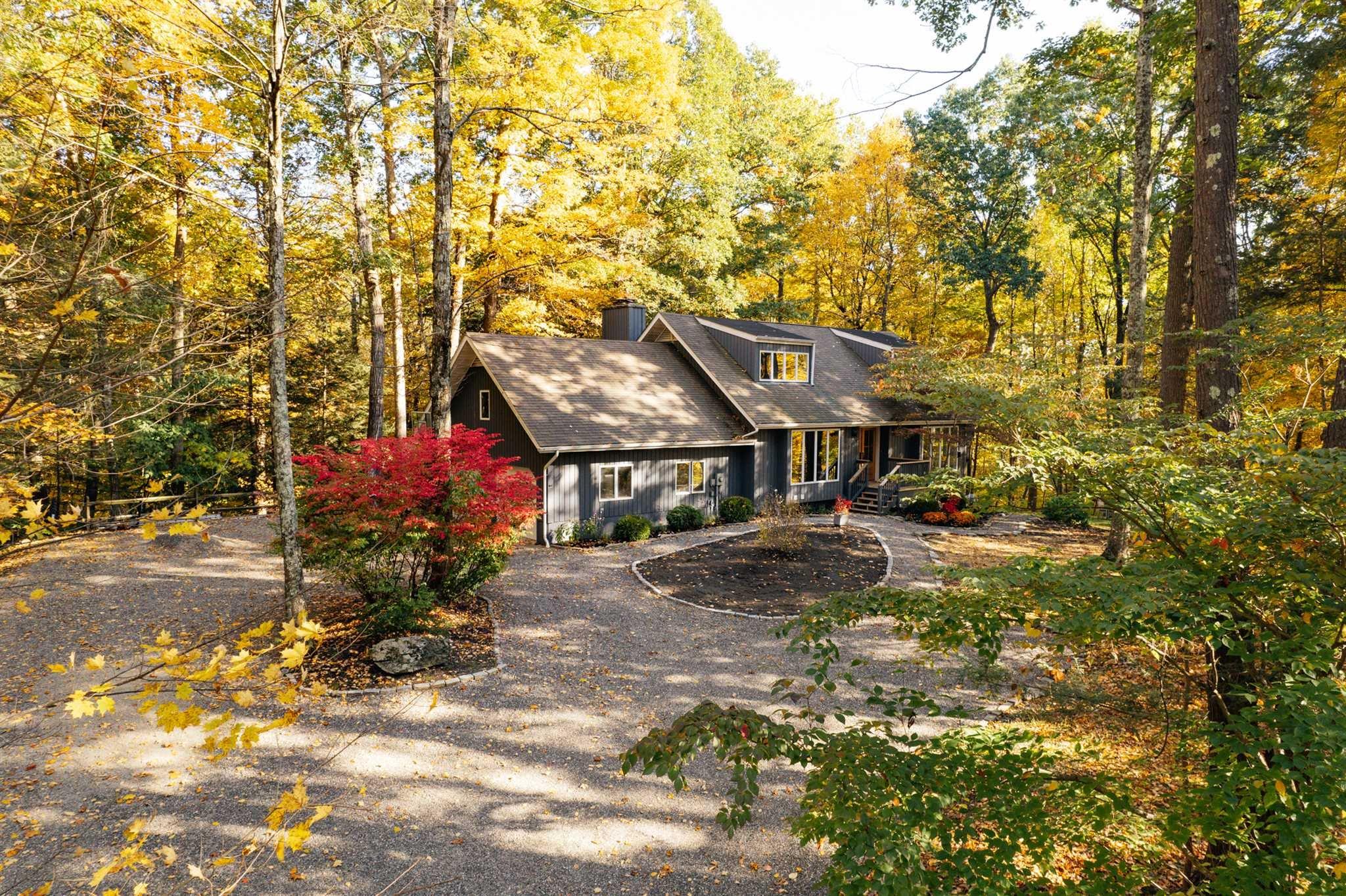 a view of house with yard