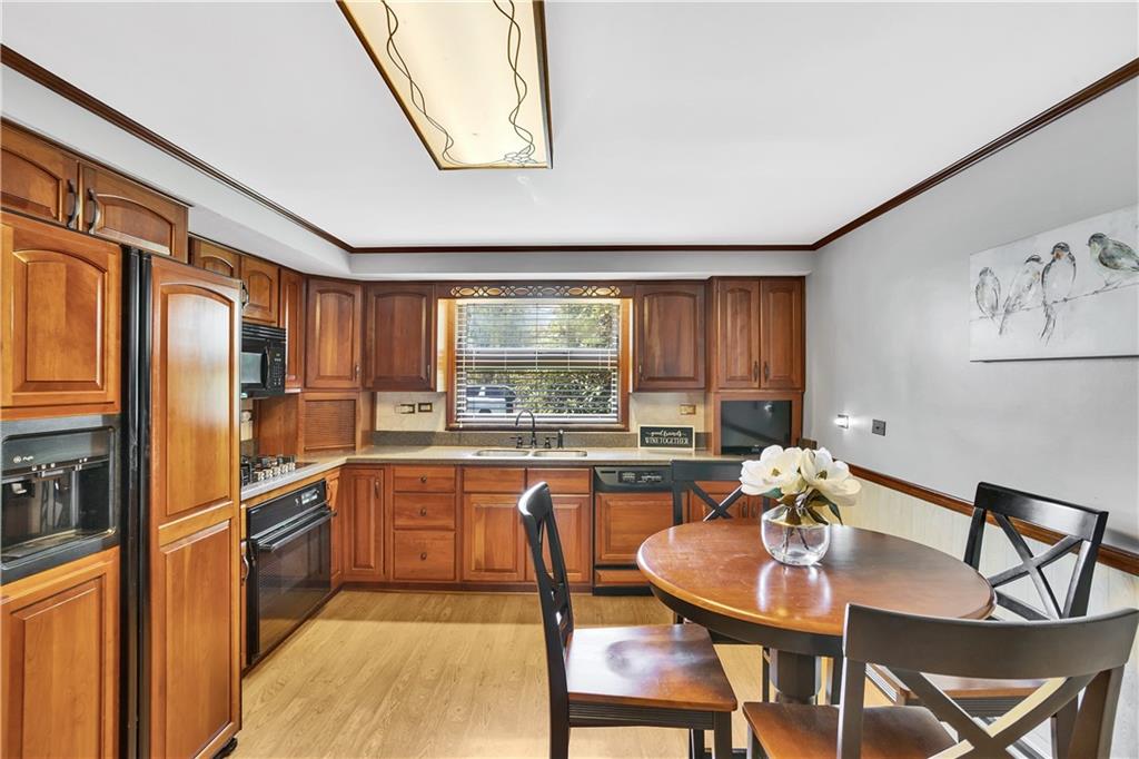 1217 Lovi Road Freedom, PA 15042 - Photo 11 of 39 Wonderfully updated kitchen with built-in refrigerator and dishwasher. JennAir gas cooktop with 5 burners.