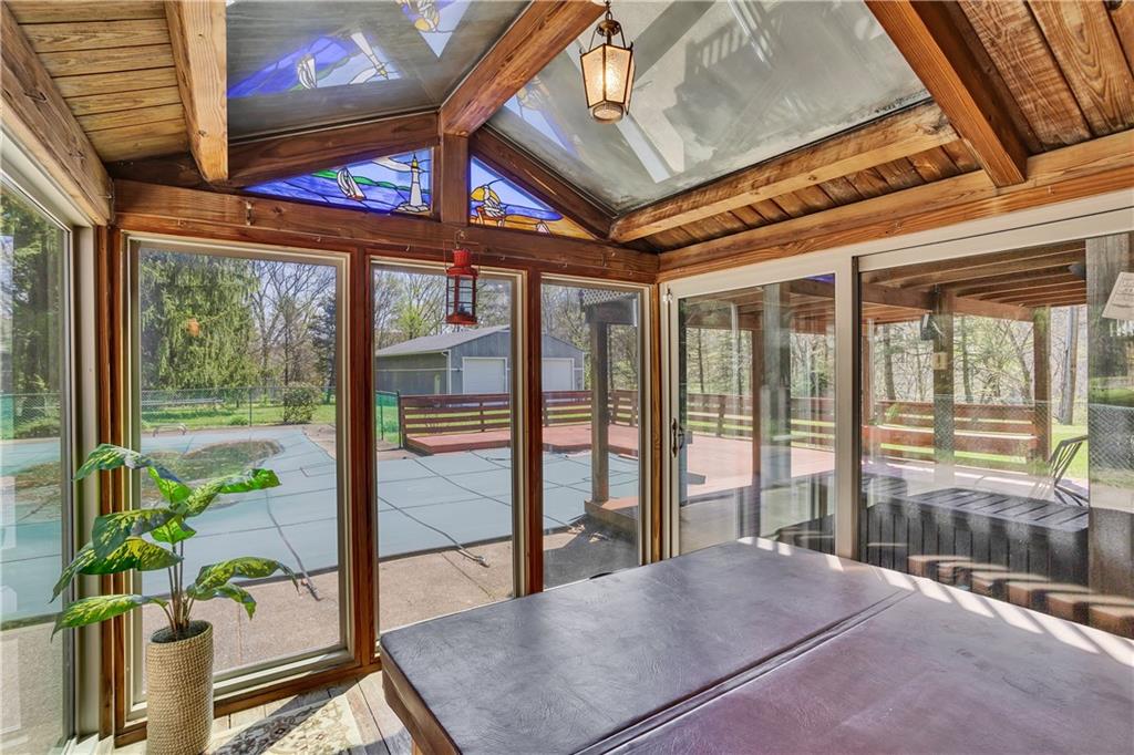 1217 Lovi Road Freedom, PA 15042 - Photo 17 of 39 You're own Hot Tub Room with new slider doors and new windows with stained glass accent. Metal roof.