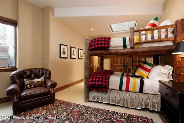 a living room with furniture rug and window