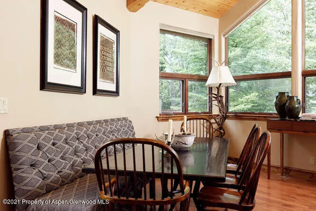 a view of a dining room with furniture window and outside view