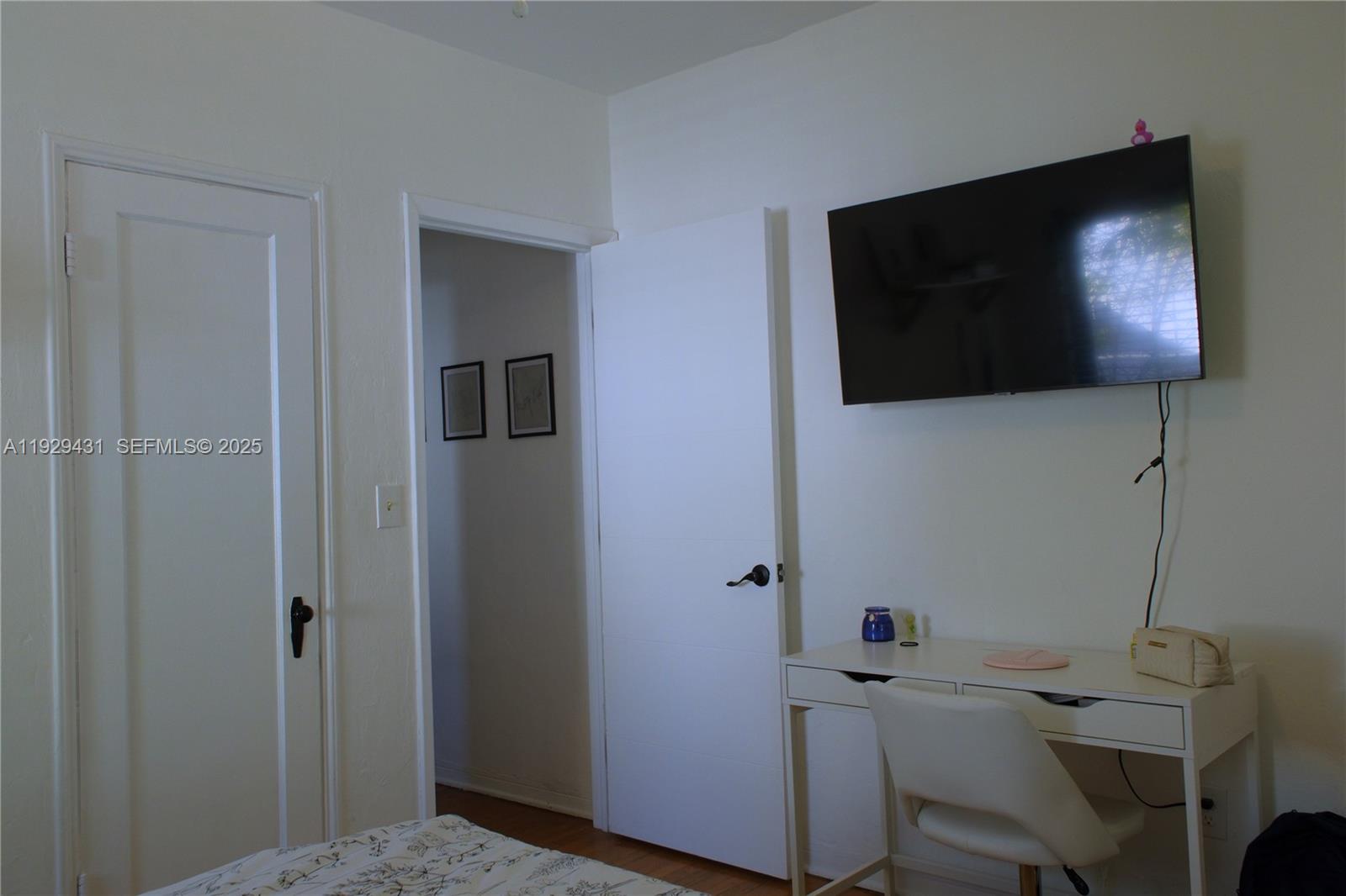 2818 Southwest 19th Street Miami, FL 33145 - Photo 19 of 43 a view of a room with workspace and flat screen tv
