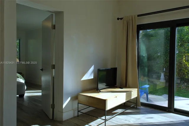 a room with furniture and wooden floor