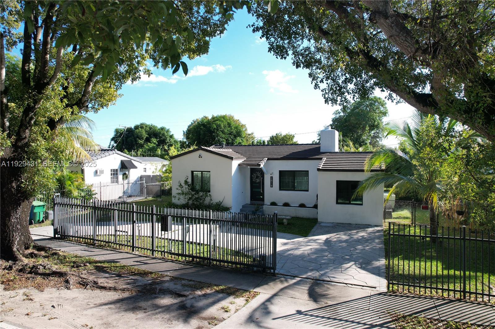 2818 Southwest 19th Street Miami, FL 33145 - Photo 3 of 43 a front view of a house with a yard