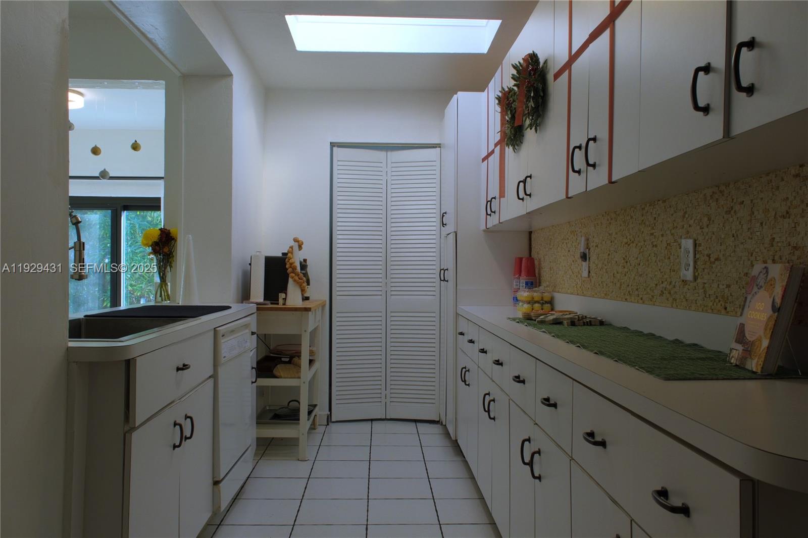 2818 Southwest 19th Street Miami, FL 33145 - Photo 31 of 43 a kitchen with cabinets and appliances