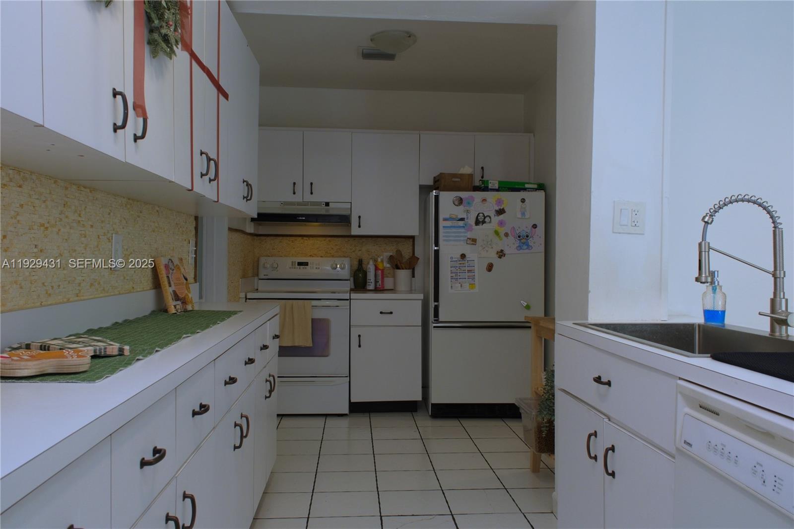 2818 Southwest 19th Street Miami, FL 33145 - Photo 33 of 43 a kitchen with cabinets and appliances