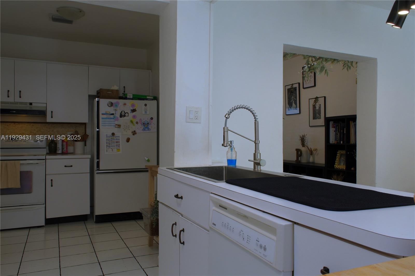 2818 Southwest 19th Street Miami, FL 33145 - Photo 34 of 43 a kitchen with a refrigerator and cabinets